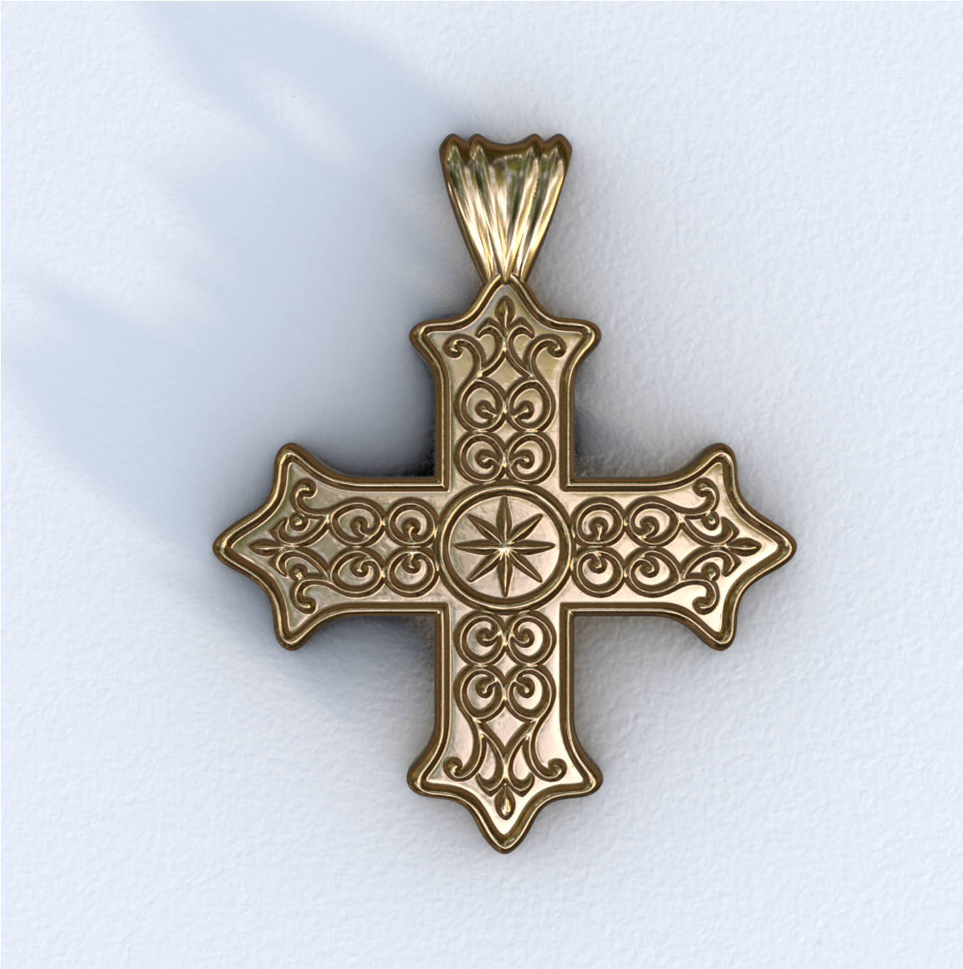 Gold cross pendant on a white background
