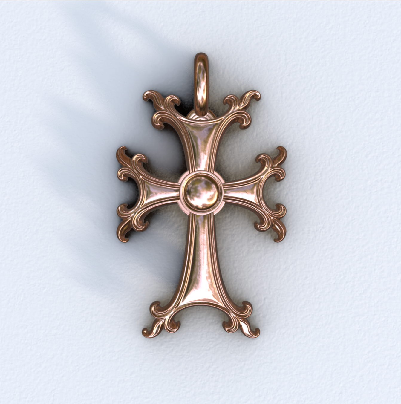 Rose gold cross pendant on a light gray background